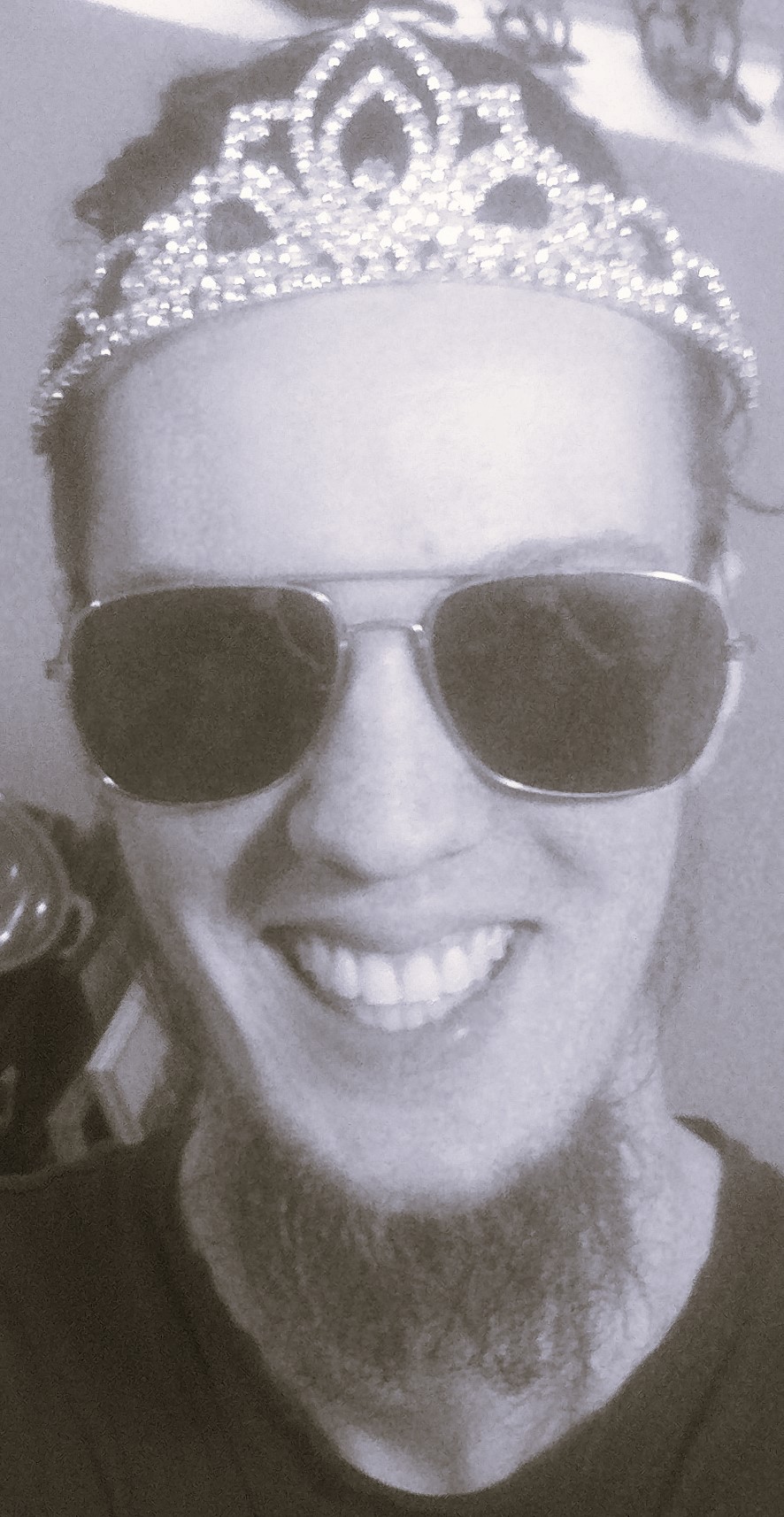 Bearded man with sunglasses and tiara
